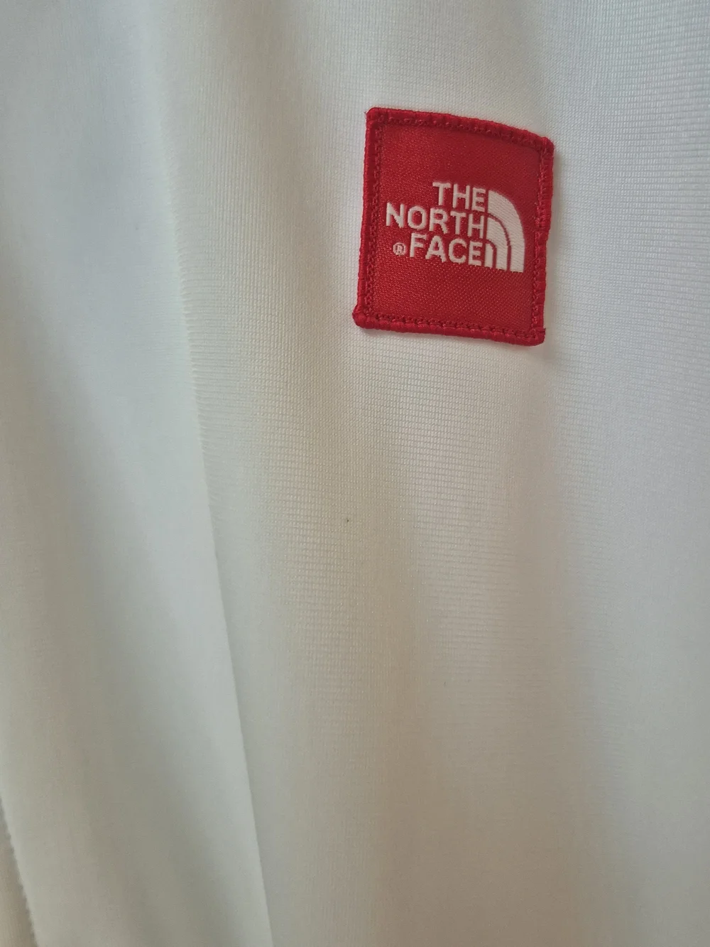 The North Face White Hooded Zip-Up Jacket with Red Logo